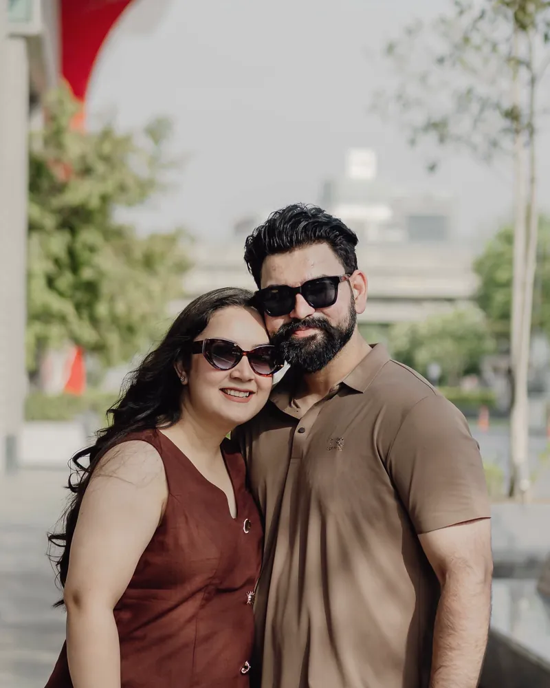 Shubhangi and Dhruv, smiling side by side